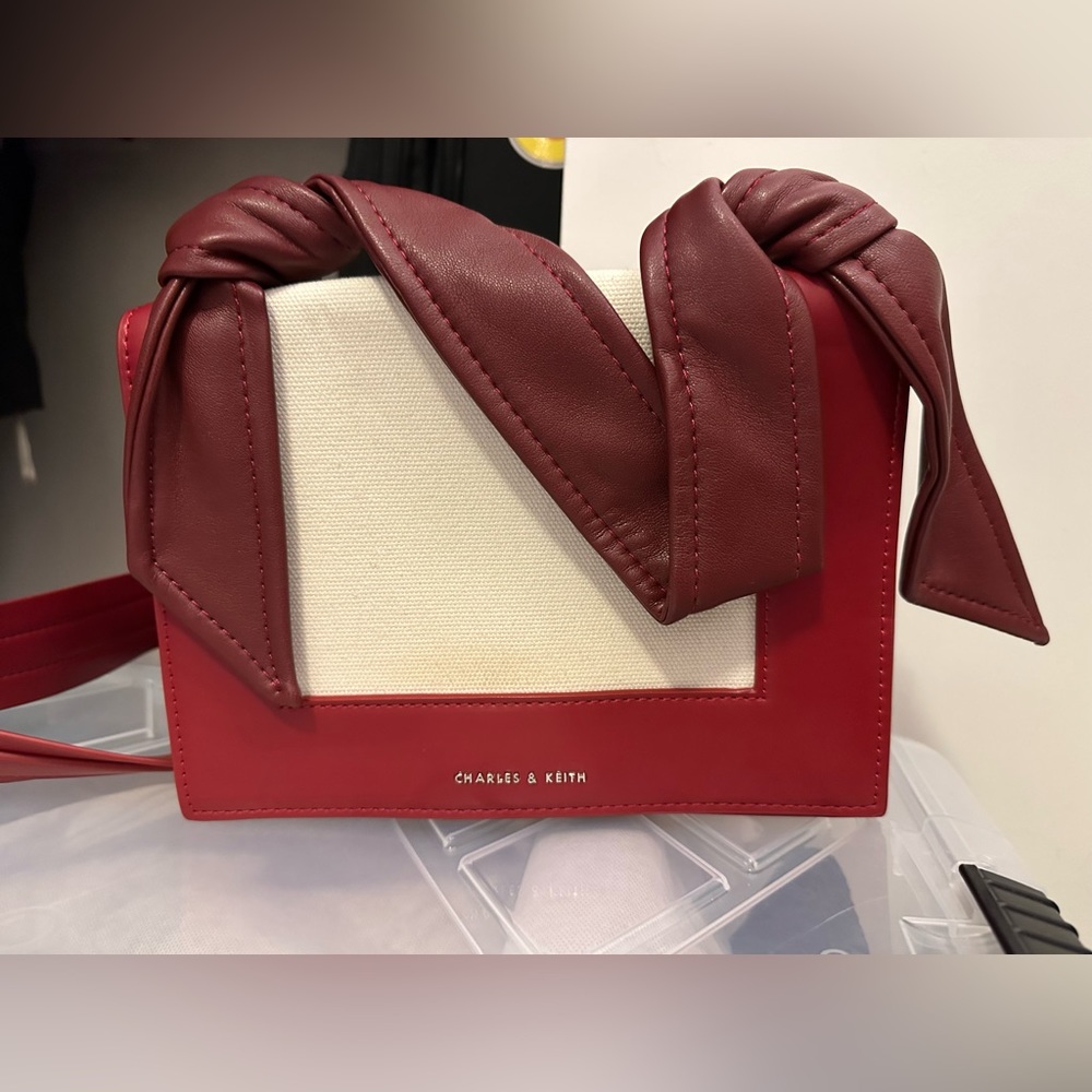 Charles & Keith red bunny ear looking bag